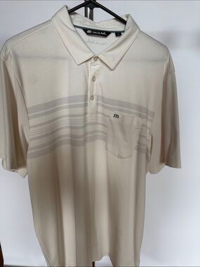 Travis Mathew Cream Polo with Subtle Horizontal Stripe